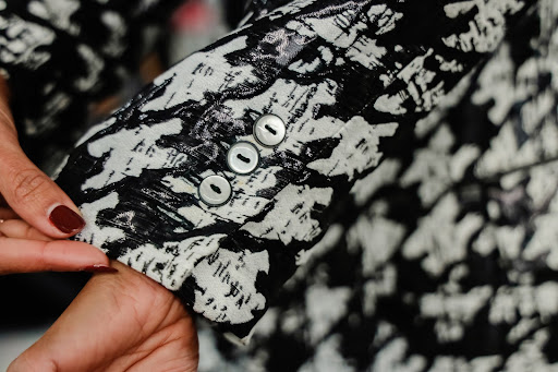 Closeup of a black and white pattened jacket on a model